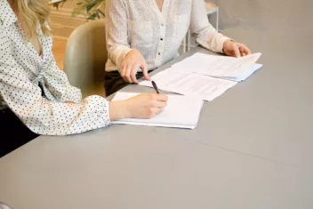 picture of two women looking at CVs