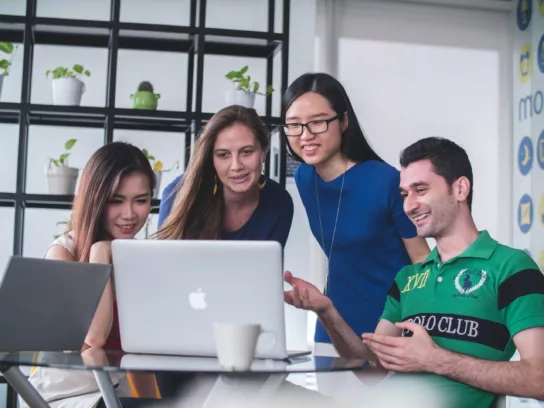 Group of young people looking at a pc